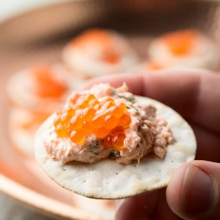 Salmon dip on a cracker topped with caviar.