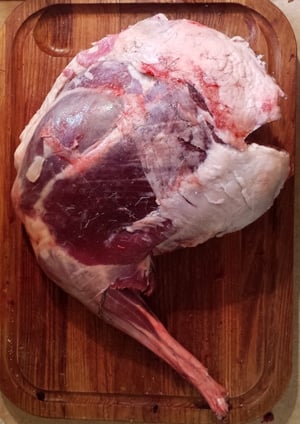 venison hind leg on cutting board