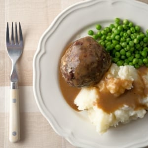 British meatballs with mashed potatoes and peas