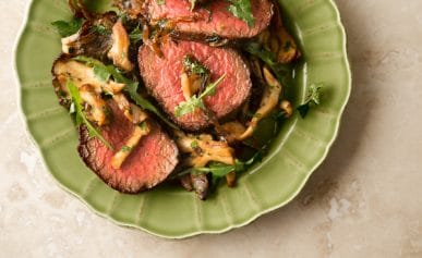 venison steaks with caramelized onions and mushrooms