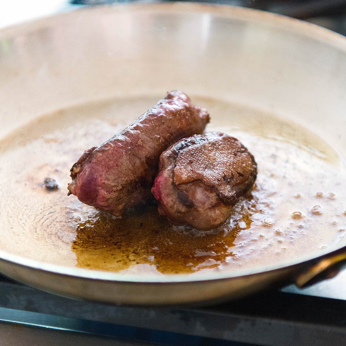 Standing up two duck breasts to cook the sides. 