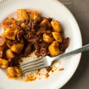 Duck ragu on the plate, being eaten