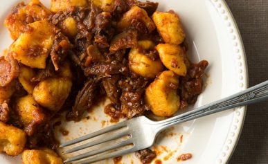 Duck ragu on the plate, being eaten