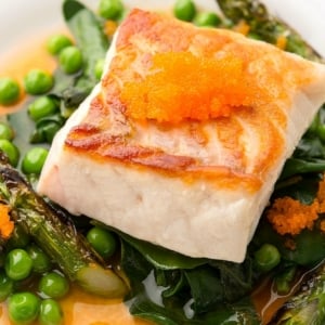 Closeup of seared fish and asparagus