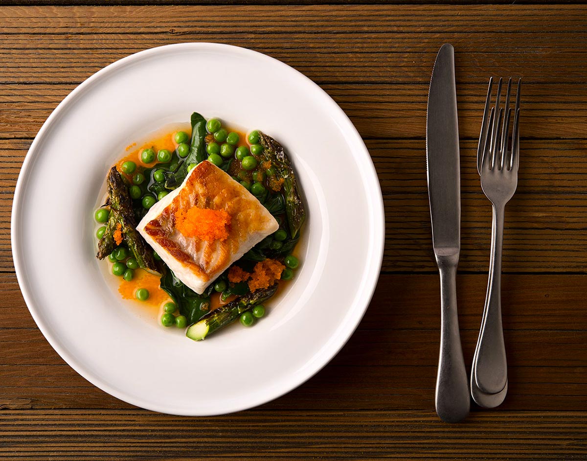 Seared fish and asparagus on a plate