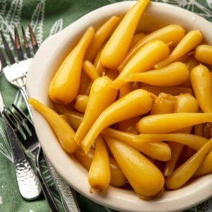 A bowl of pickled ramps, pickled with saffron.