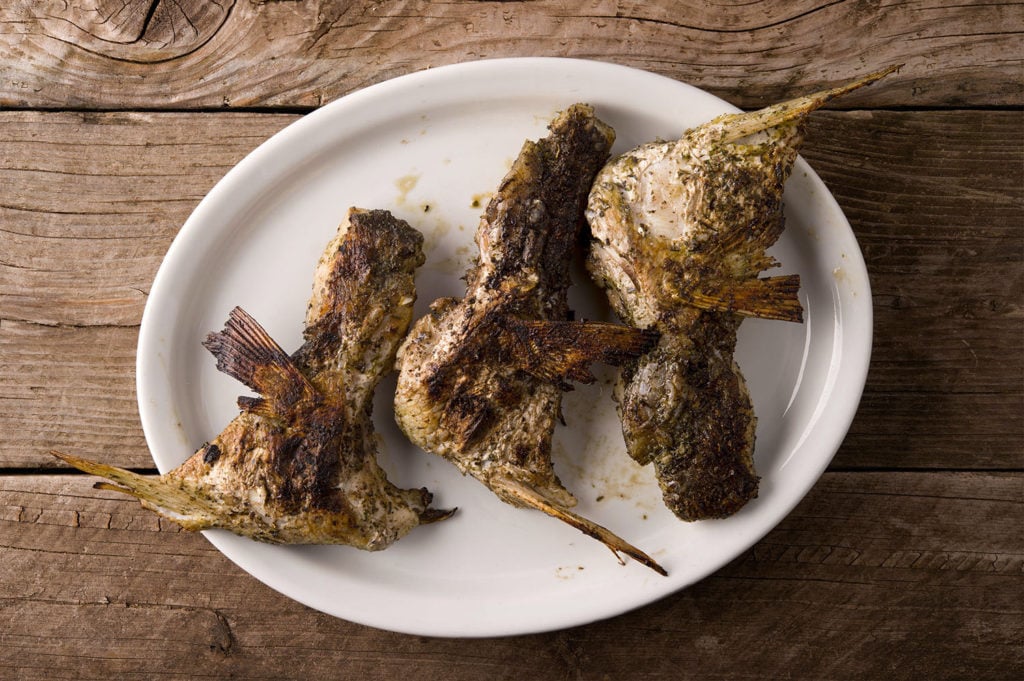 grilled fish collars on a platter. 