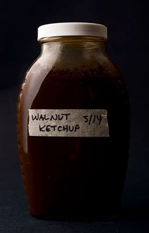 A close up of a bottle of walnut ketchup.