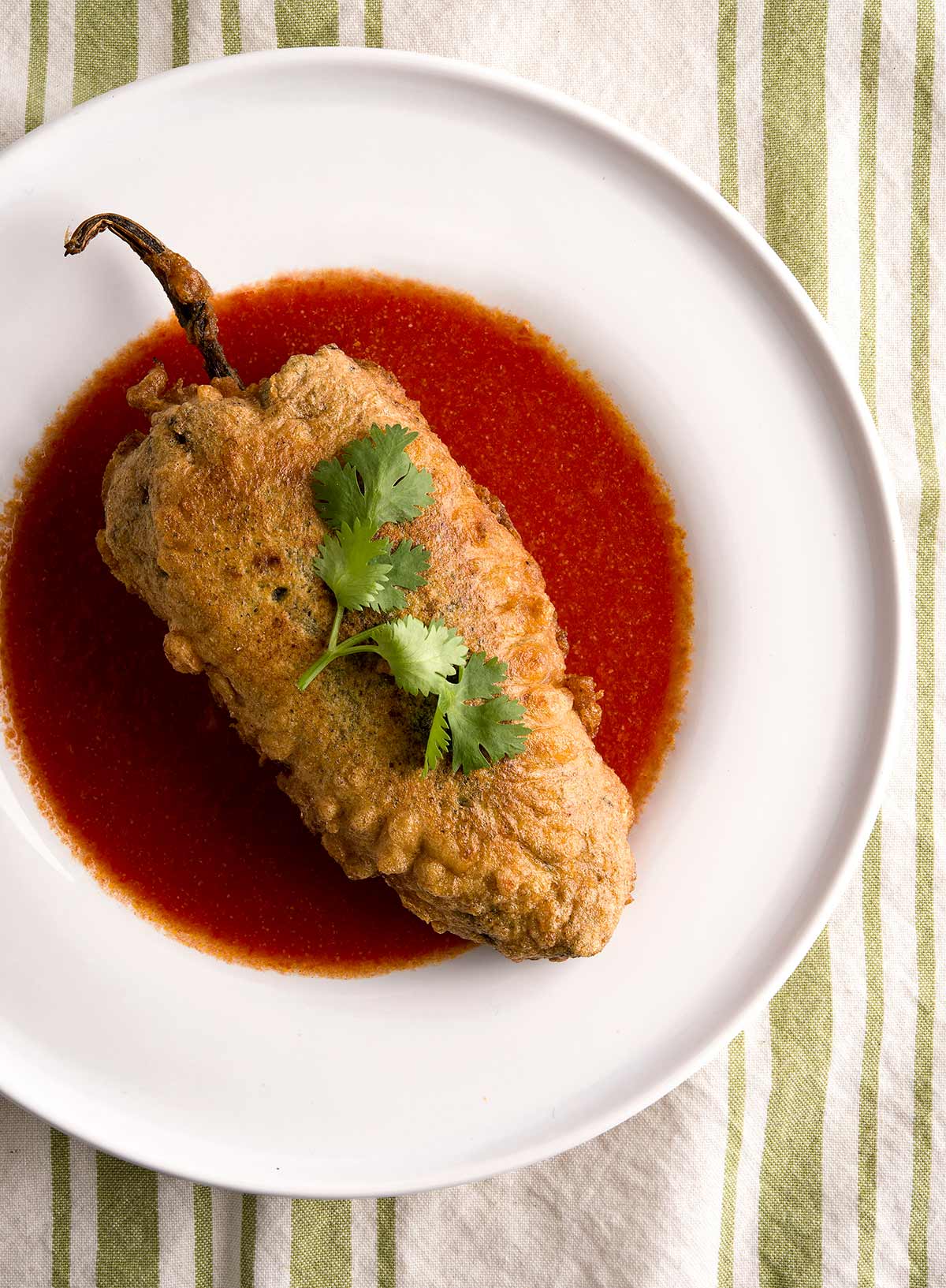 Chile poblano rellenos with tomato sauce