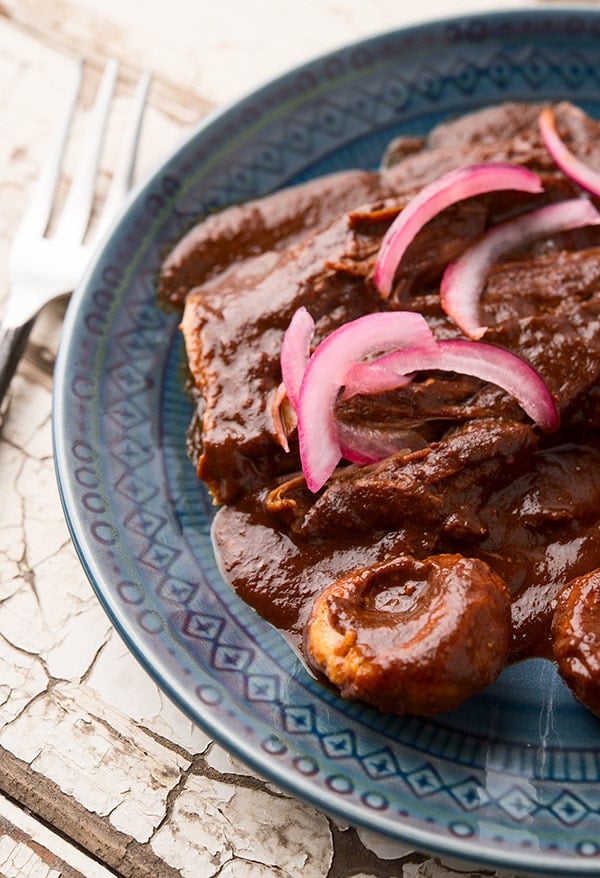 Mole chichilo with chochoyotes on a plate. 