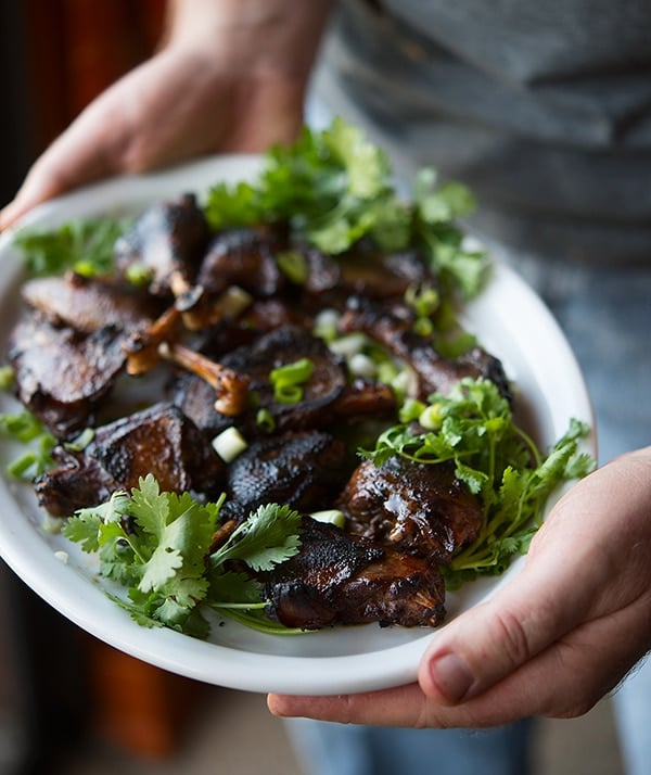 Teriyaki duck legs on a platter