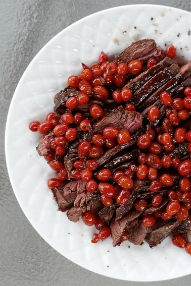 Sage grouse with red currants