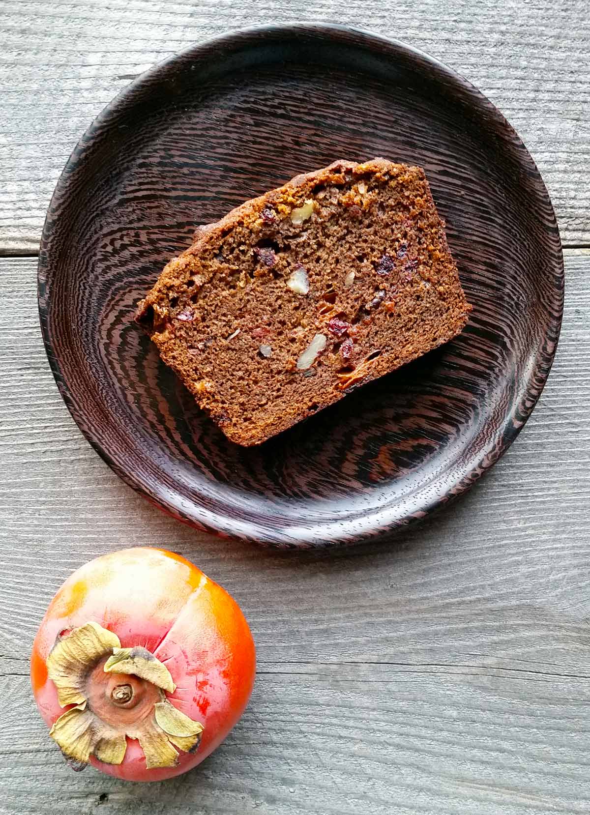 A slice of persimmon bread on a plate