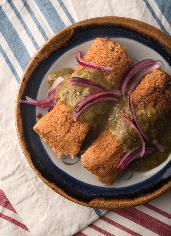 two venison tamales on a plate