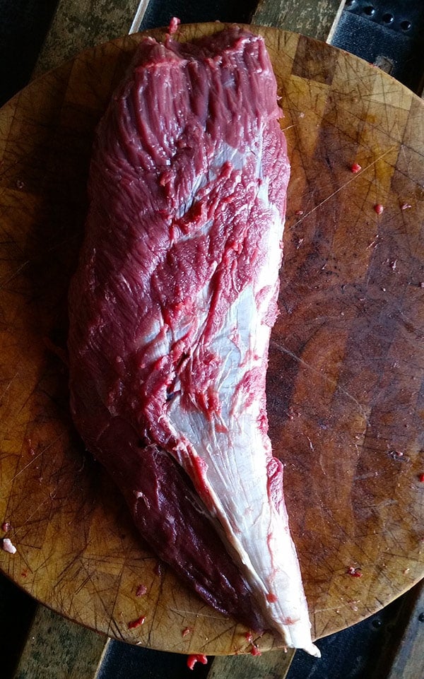 overhead shot of silverskin in the center of a blade roast