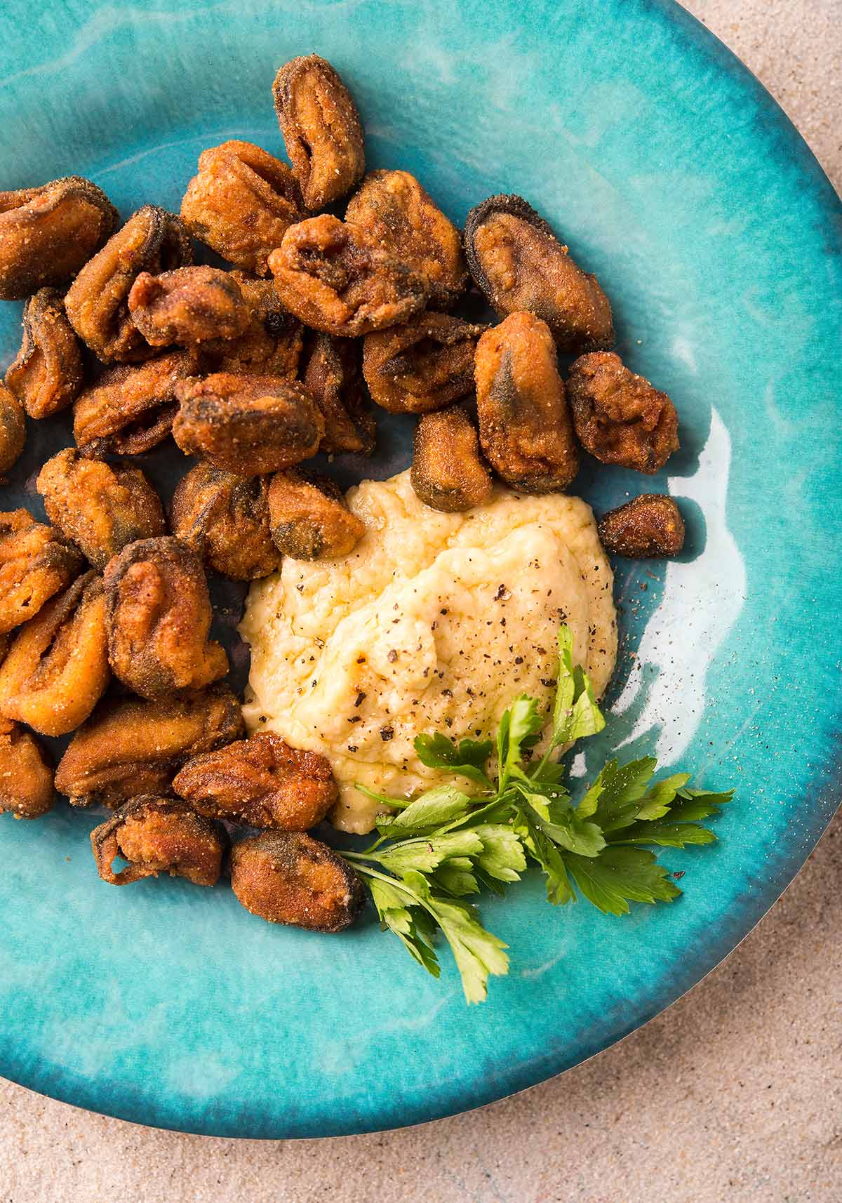 A plate of fried mussels with skordalia