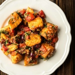 Fish puttanesca on a plate