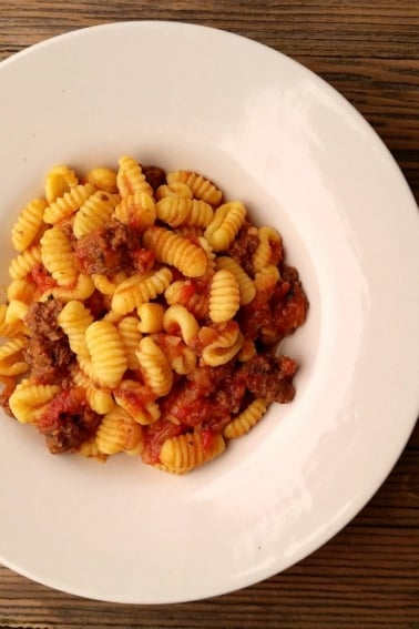 Bowl of malloreddus pasta with tomato sauce