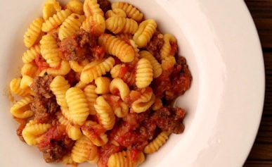 Bowl of malloreddus pasta with tomato sauce