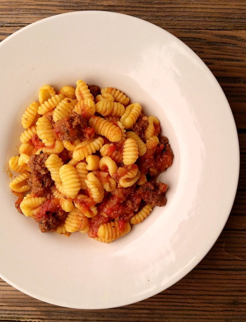 Bowl of malloreddus pasta with tomato sauce