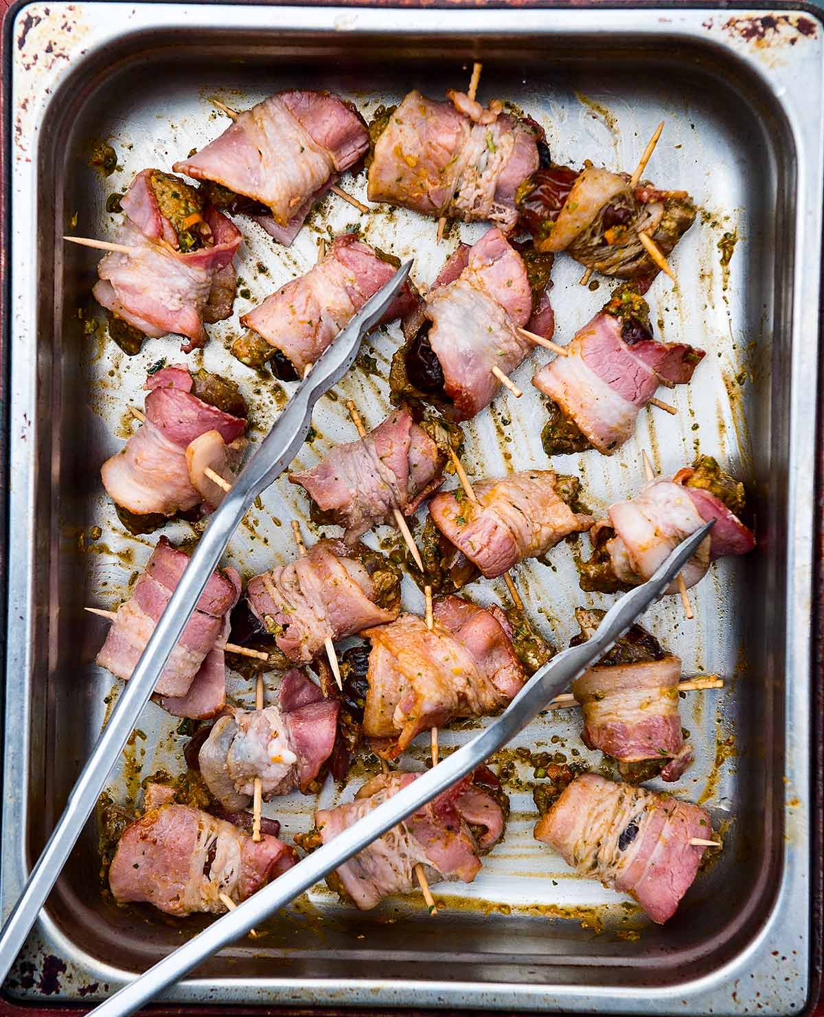 A tray of bacon wrapped dove ready to grill. 