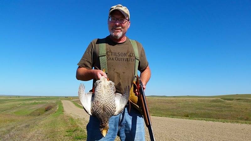 Hank Shaw with a prairie chicken
