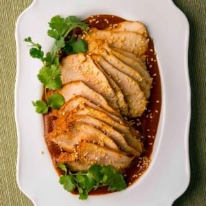 Slices of turkey breast with turkey mole sauce