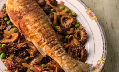 trout with morels on a platter, ready to eat