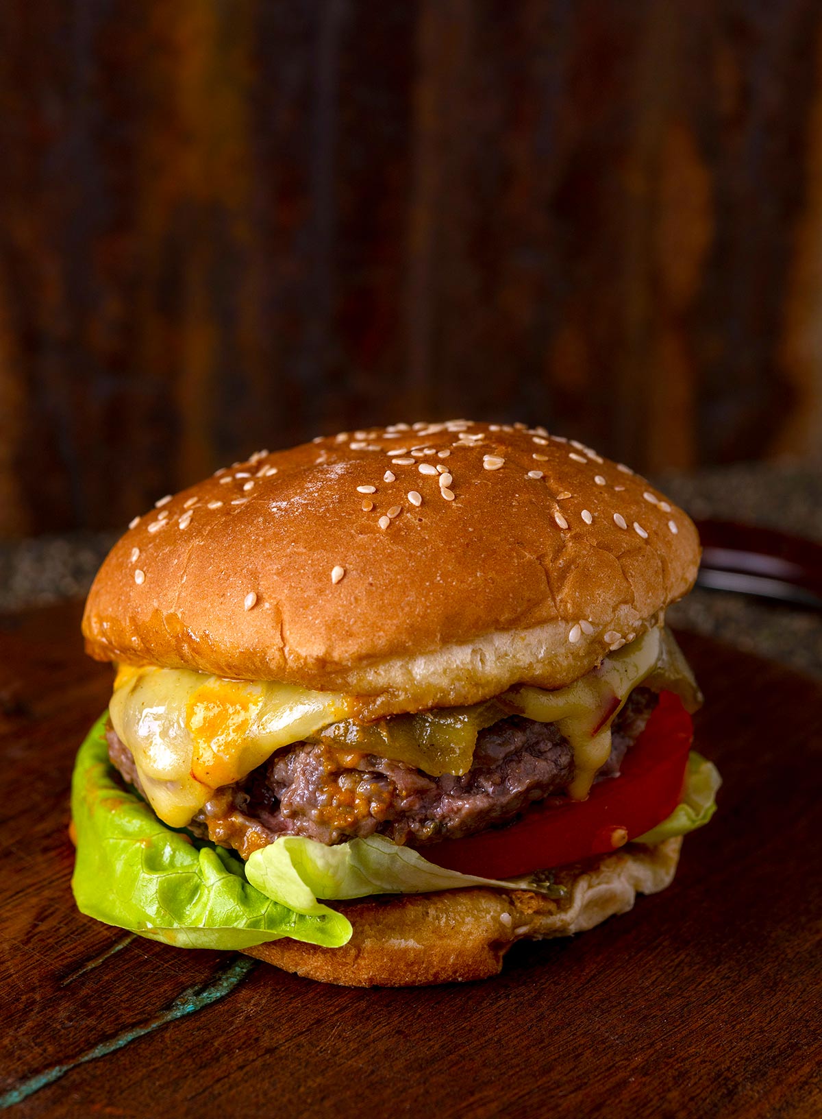 A green chile elk burger, ready to eat