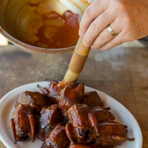 Putting sauce on BBQ doves