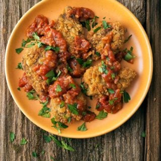 Southern tomato gravy on a plate with chicken fried doves