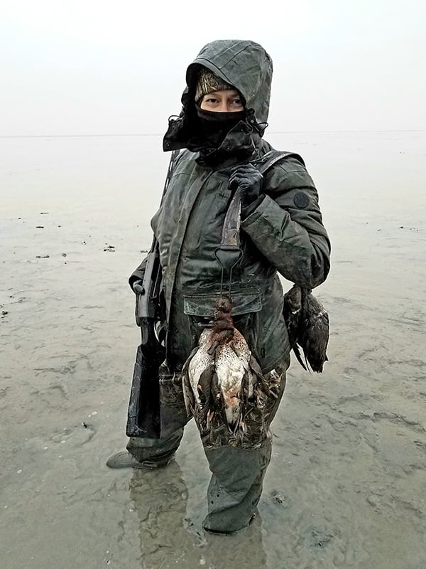 Holly Heyser with a strap of ducks