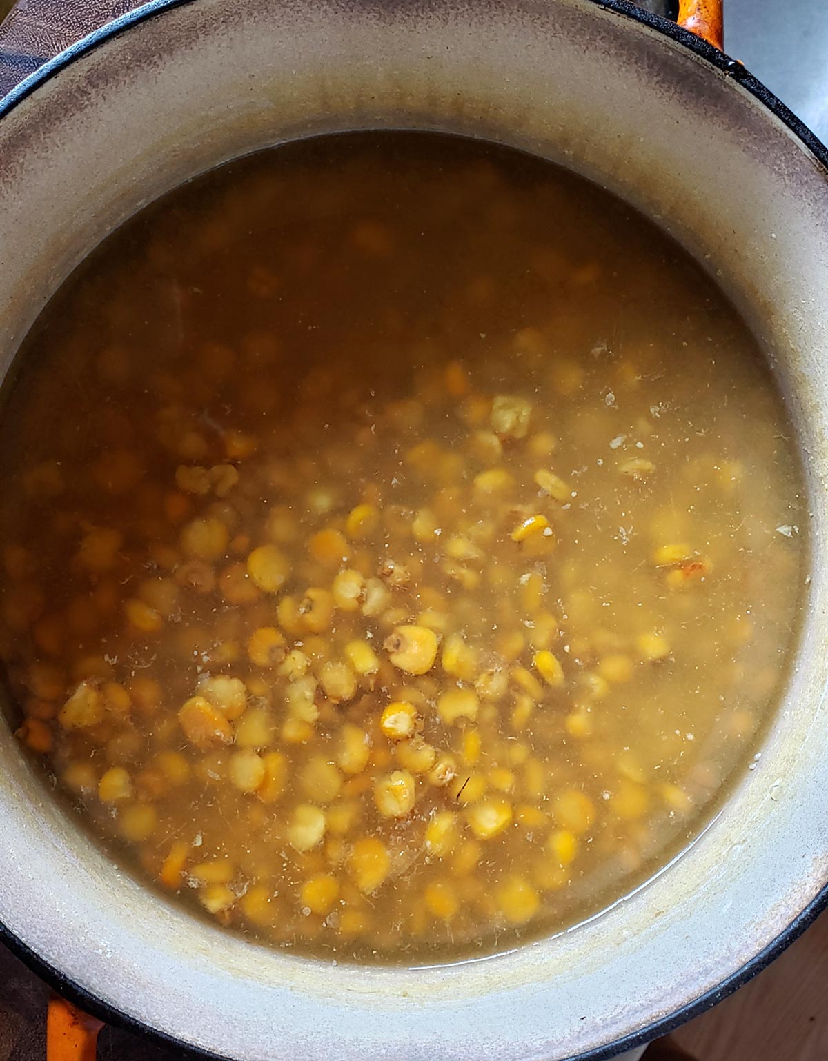 A pot of sludgy corn, ready to be rinsed. 