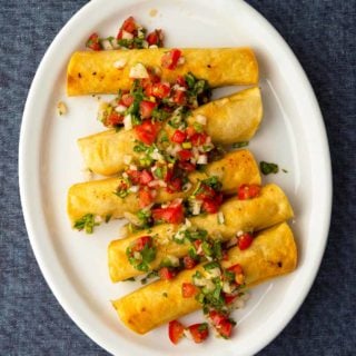 A platter of tacos dorados, or taquitos