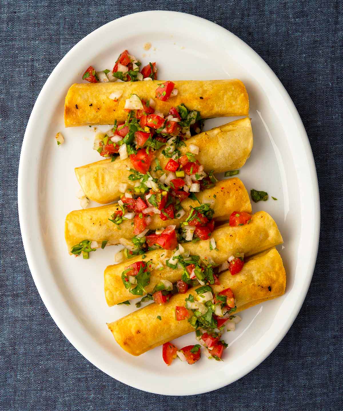 A platter of tacos dorados, or taquitos