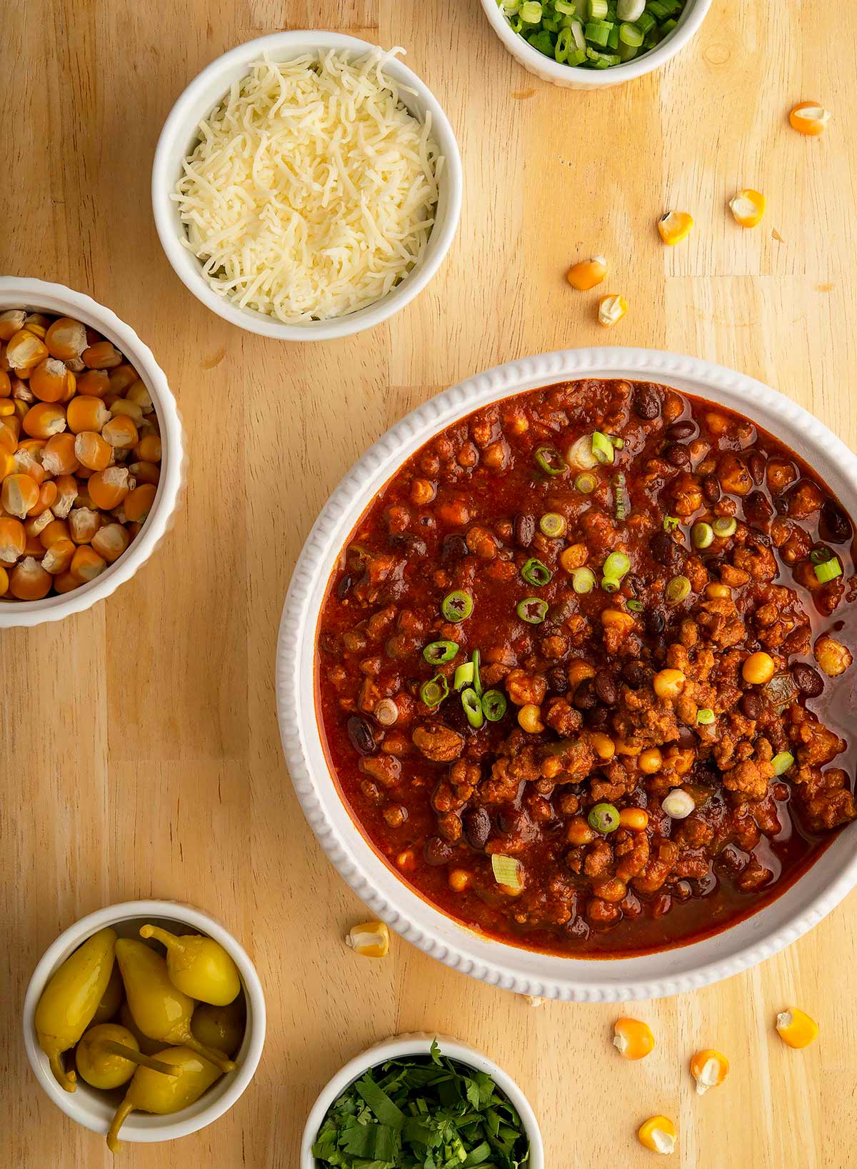 A bowl of turkey black bean chili with toppings