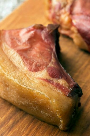 Closeup of smoked pork chops on a cutting board