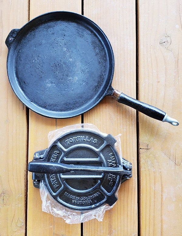 Tortilla baking on a camal skillet on the stove top. Stock Photo