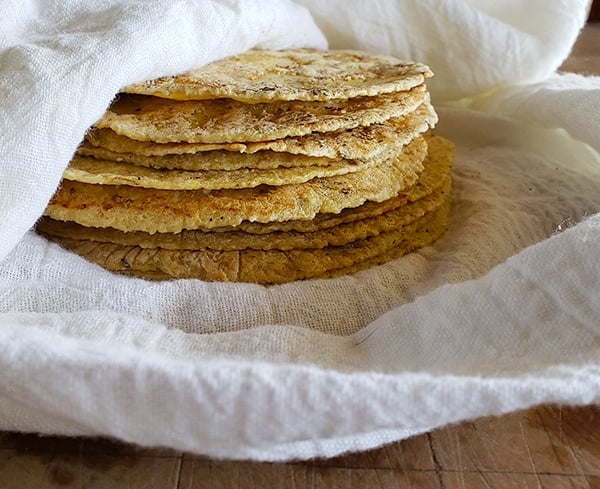 A stack of homemade corn tortillas