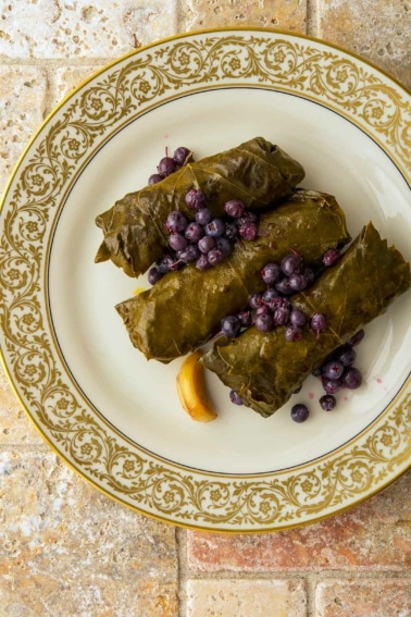 A serving of stuffed grape leaves on a plate