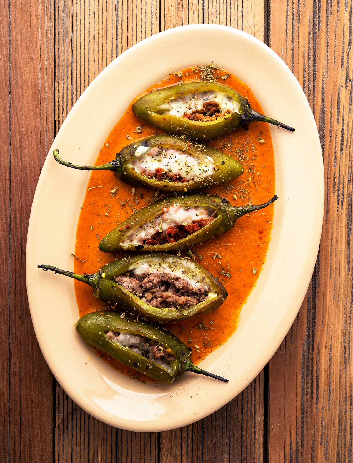 A platter of sausage stuffed peppers