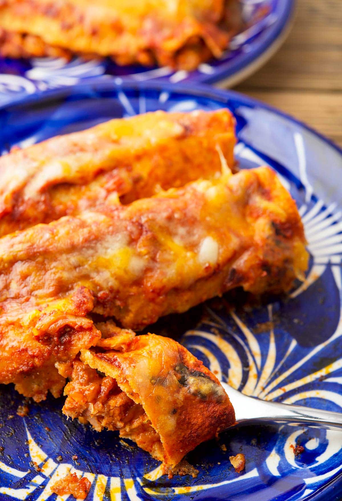 Closeup of enchiladas rojas on a plate