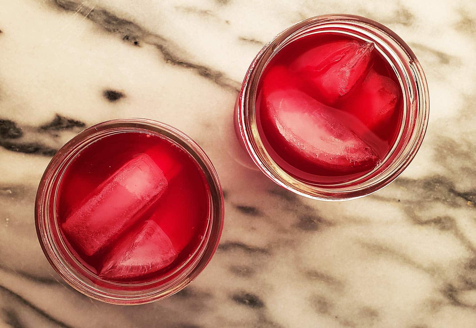 prickly pear juice over ice in glasses