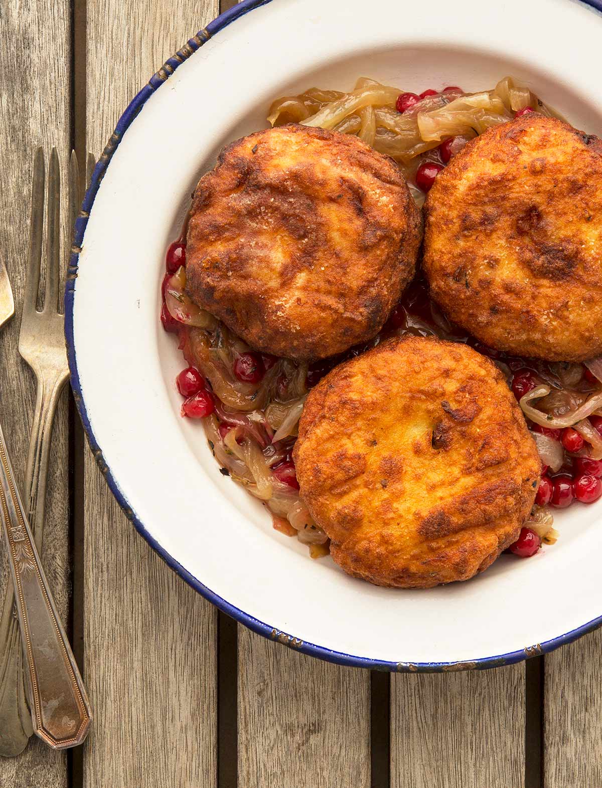 Fried Swedish potato dumplings with onions on a plate