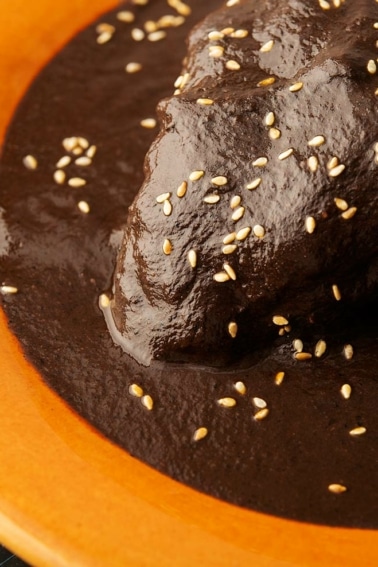 A plate of mole negro with turkey.