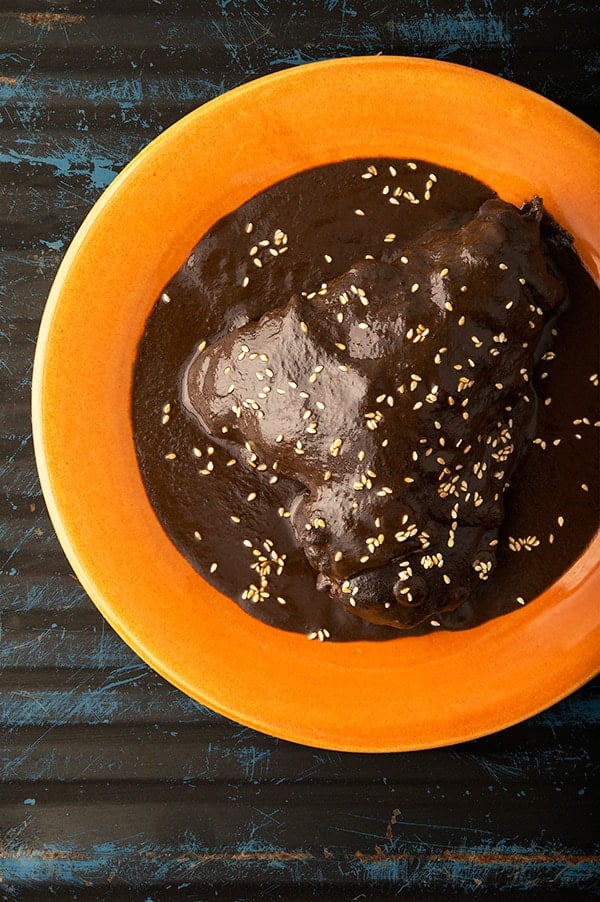 Mexican mole negro with turkey on a plate