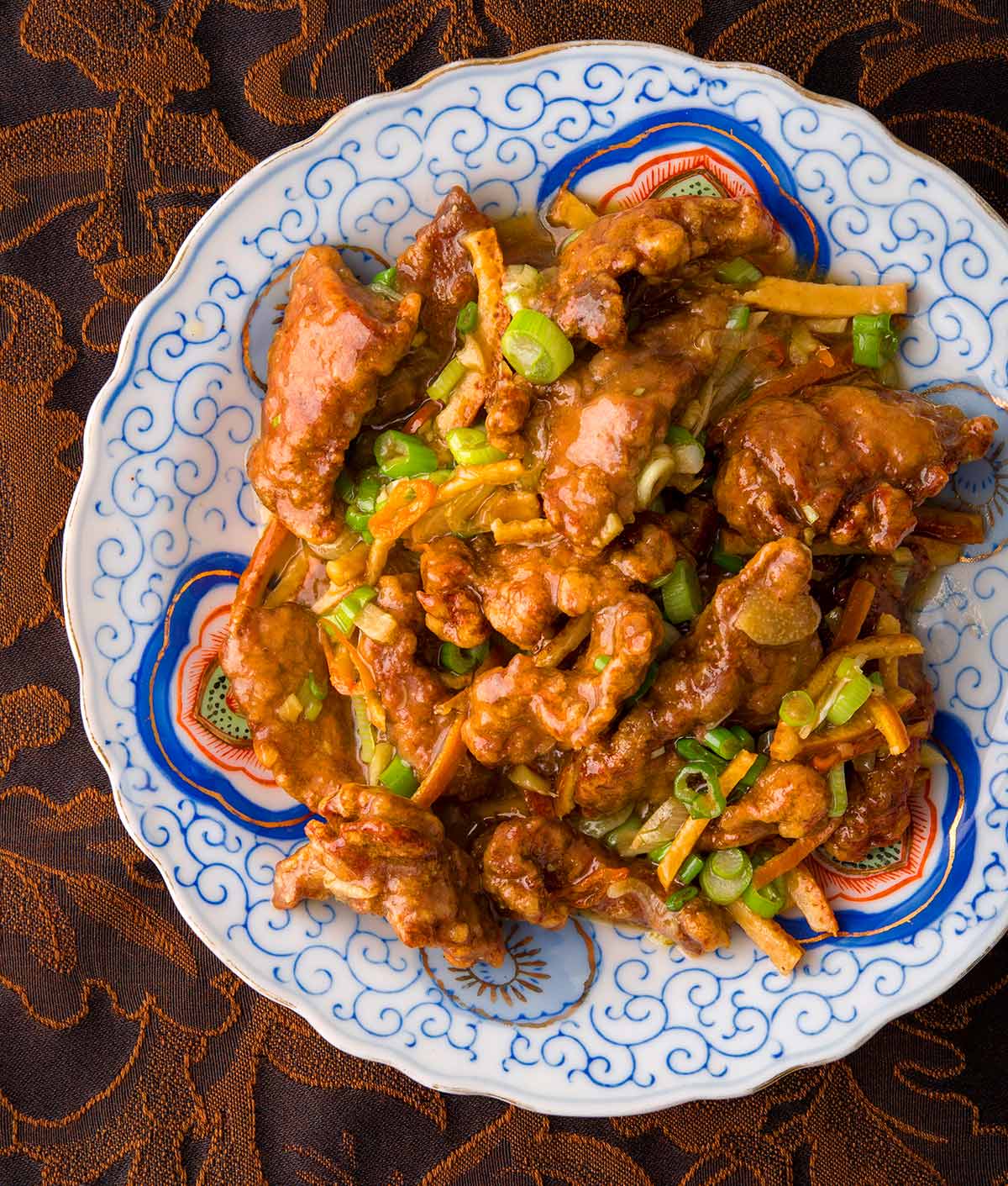 Chinese tangerine beef on a plate. 