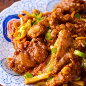 Close up of Chinese tangerine beef on a plate.