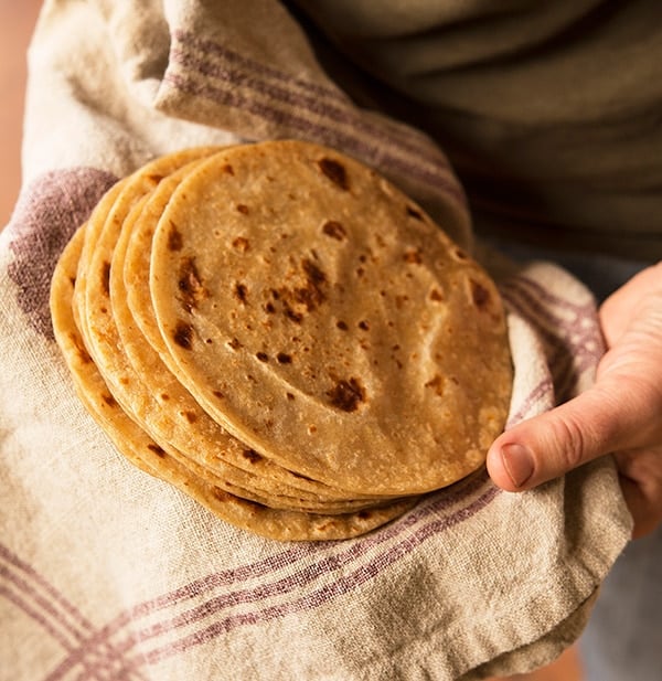 A stack of homemade flour tortillas