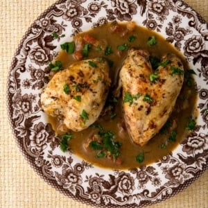 A red eye gravy recipe served with quail on a plate